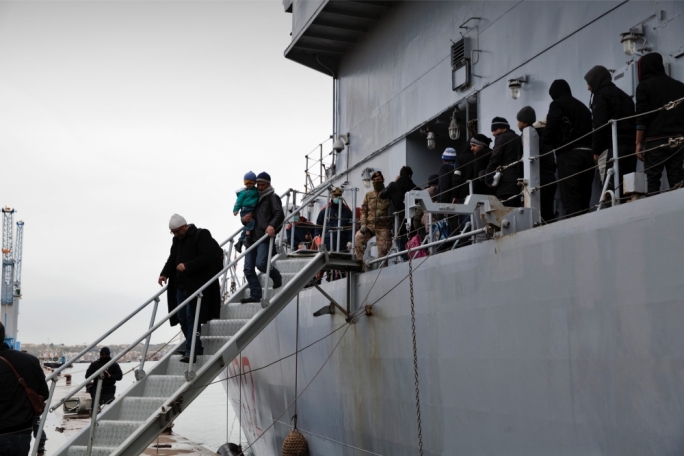 Syrian migrants disembarking from an Italian navy ship, before being transferred a reception centre in Siracusa, Sicily. Photo: Francesca Leonardi/Save the Children